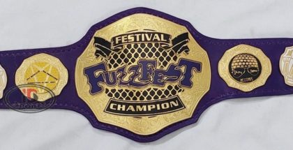 Custom championship belt with purple leather strap and gold eagle crest