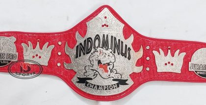 Custom championship belt with red leather strap and gold-and-white plates