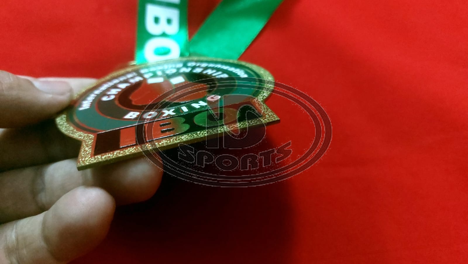 IBO custom brass medal, close-up detail