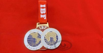 IBF custom brass medal with ribbon