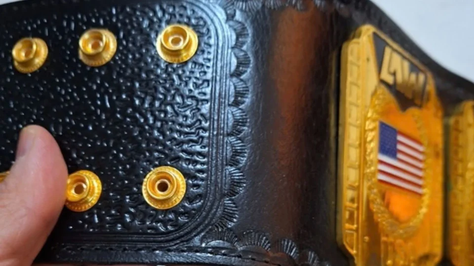 Close up of the engraved centre plate on a custom kickboxing title belt made by Ibrahim Sports
