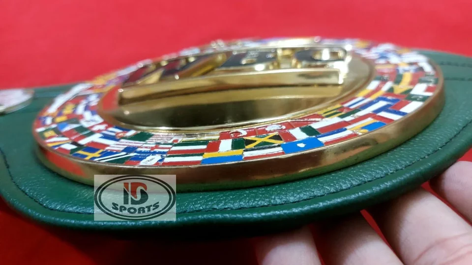 Hand painted world flags ringing the gold center plate of a WBC style green championship belt