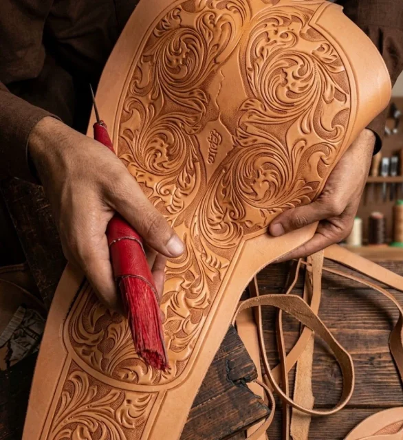Leather strap being cut to length for a boxing championship belt