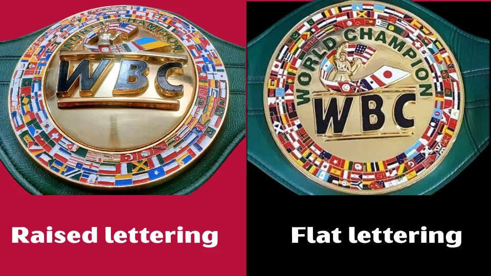 Side by side closeup of raised lettering and flat lettering on two WBC replica belt plates